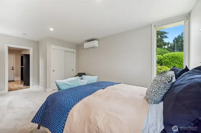 Secondary living/bedroom opens to a mud room which takes you to the backyard of the home. Notice the mini-split which keeps this room nice and cool in the summer.