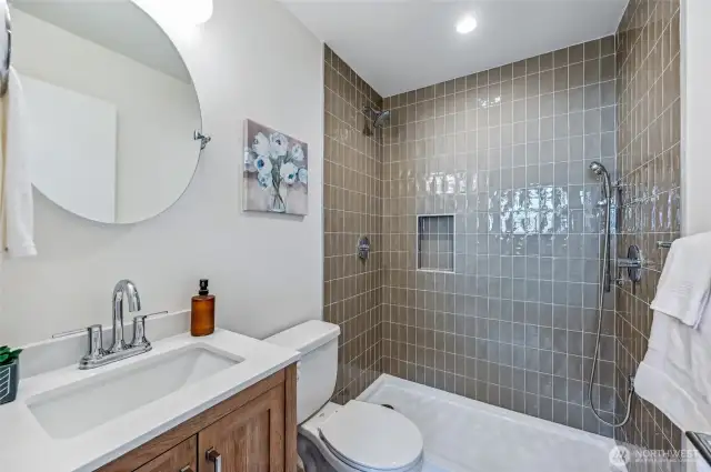 Beautiful and tasteful 3/4 bathroom is adjacent to the 2nd living space/bedroom. Double headed shower.