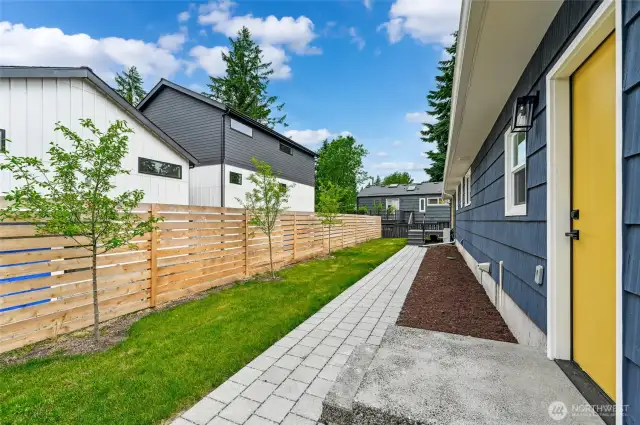 Backyard is fully fenced and has a new fence. The two homes on the left are attached ADU's that are part of this "condo" complex.
