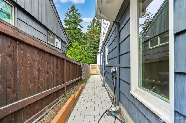 Side yard is tastefully tiled. EV Charger ready! Charger does not convey.