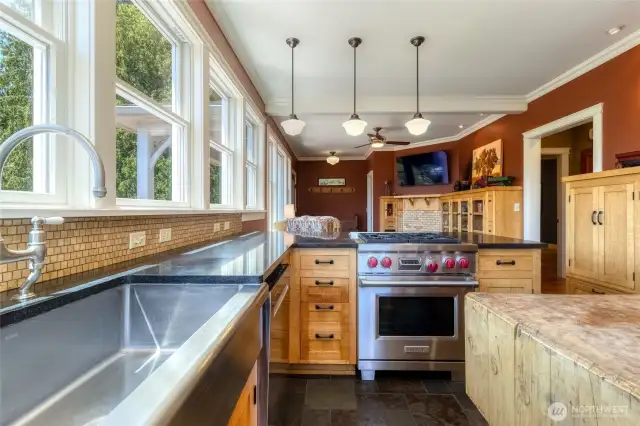 Kitchen with Farm sink, gas range & open to the Den/Family Room
