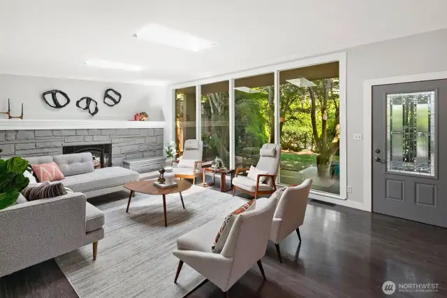 Mid century home with fireplace and floor to ceiling windows