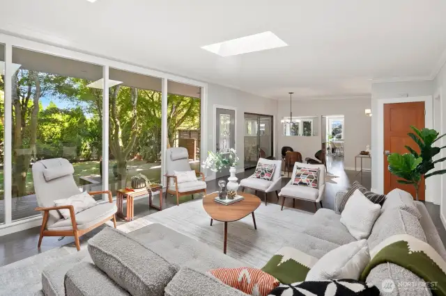 Floor to ceiling windows overlooking private front yard
