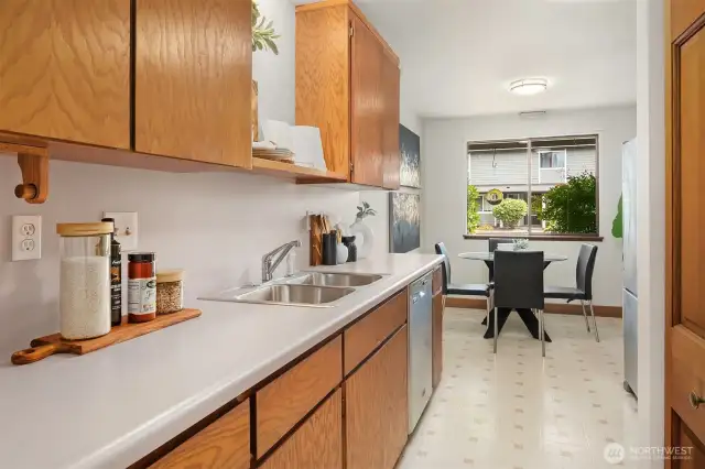 Efficient galley style kitchen with ample solid oak cabinetry.