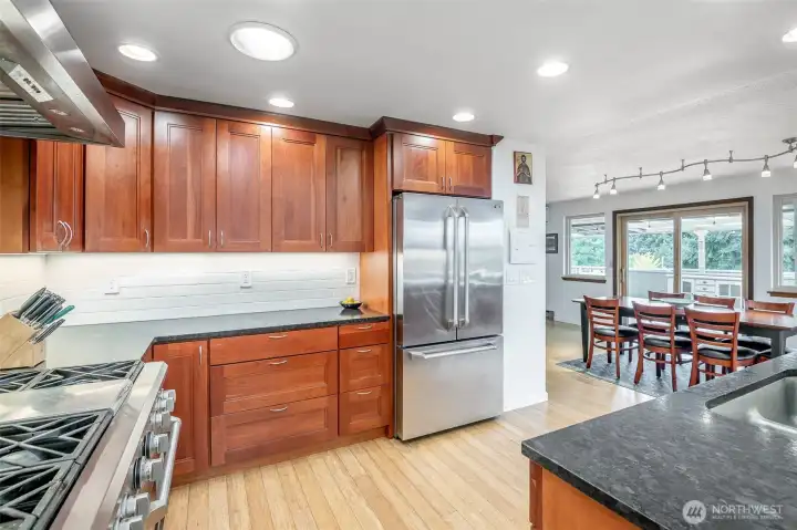 This kitchen is so bright, due to the light coming through the windows all around