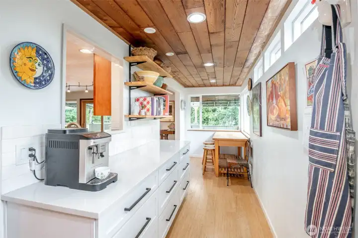 This special pass-through pantry with lots of storage and workspace will be perfect for large gatherings - set out the food and the buffet is served!