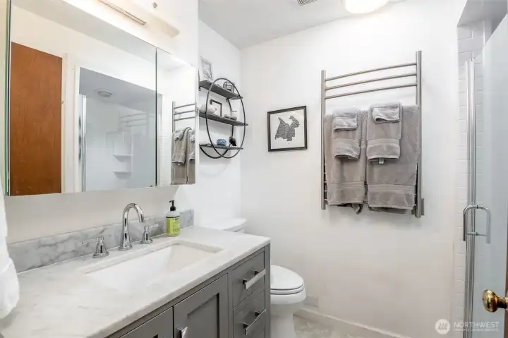Enjoy this beautiful updated 3/4 bath on the main level on the home, with towel warmers.