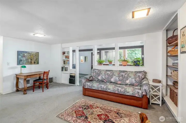 This family room on the lower levels still have plenty of light from large windows