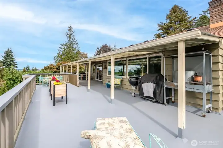 This spacious deck has room for gathering, gardening, resting and more!