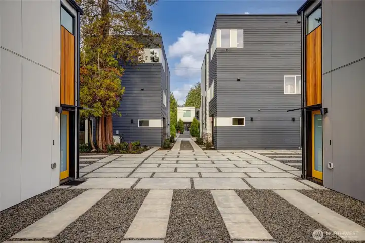 The modern clean lines extend throughout the entire property. Designated off-street parking.