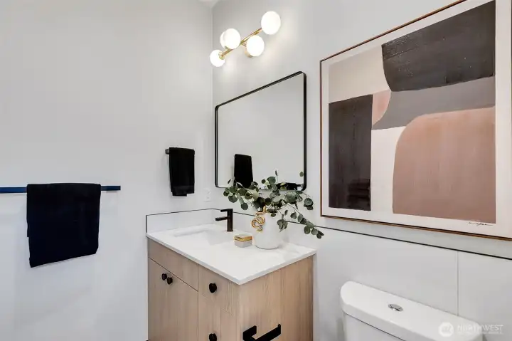 Primary ensuite features walk-in shower and vanity.