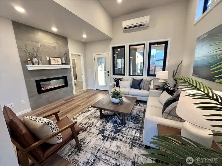 Lovely living room with electric LED fireplace and lots of windows