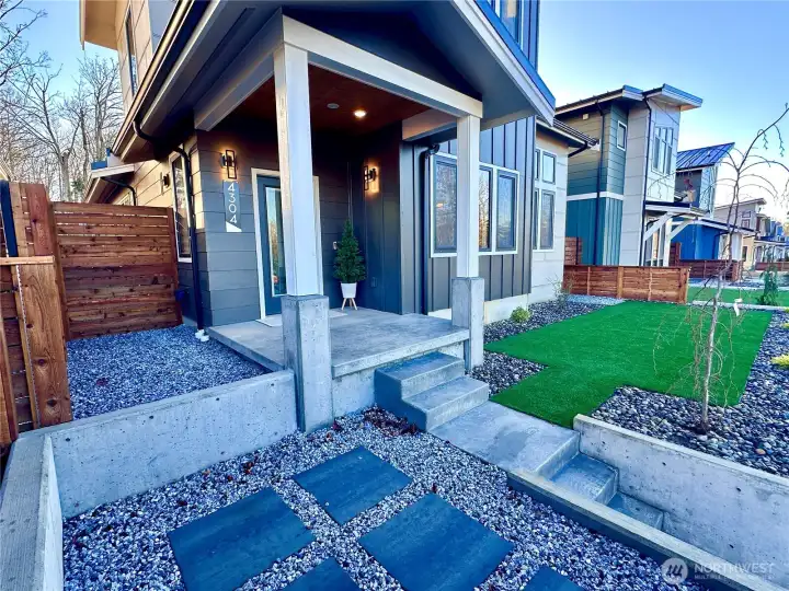 Covered front entry with easy maintenance landscaping.