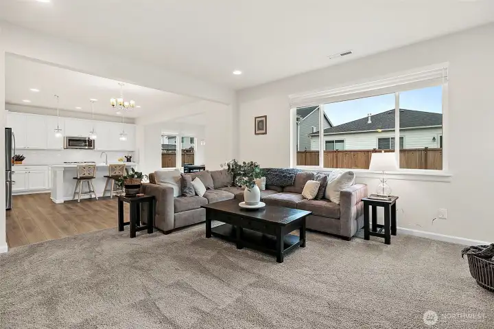 Open flow between living space and kitchen.
