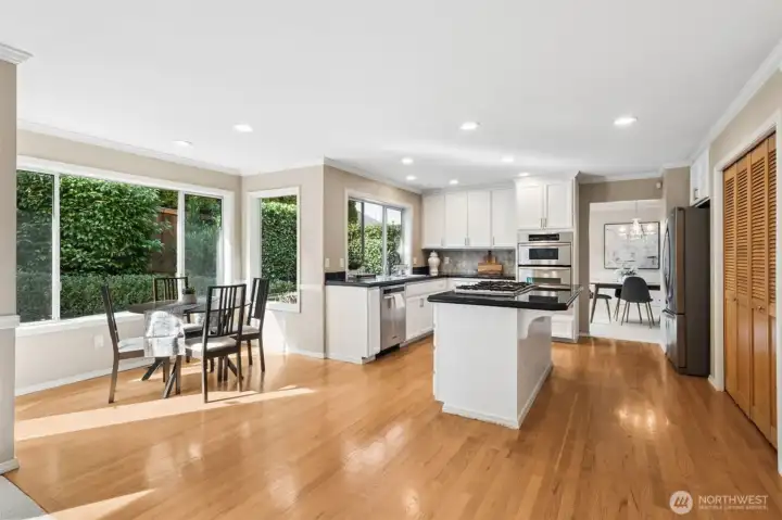 A view from the family room into the kitchen. Tons of storage in the pantry to the right of this photo.