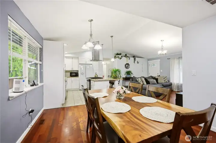 Another view of the dining area, highlighting the seamless flow into the kitchen.
