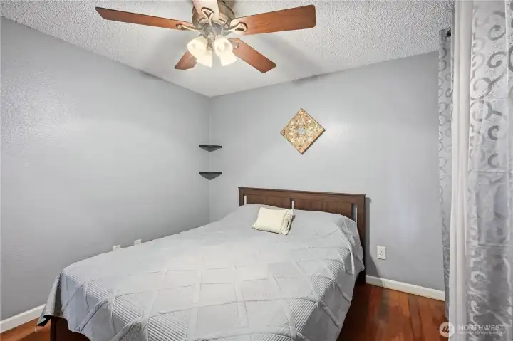 Bedroom 2 with ceiling fan and closet.