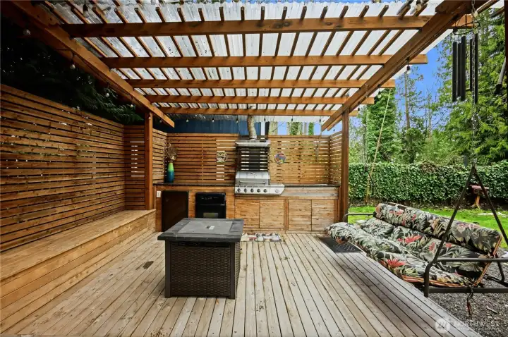 Dedicated outdoor kitchen and grilling station, perfect for hosting al fresco dinner parties in any weather.
