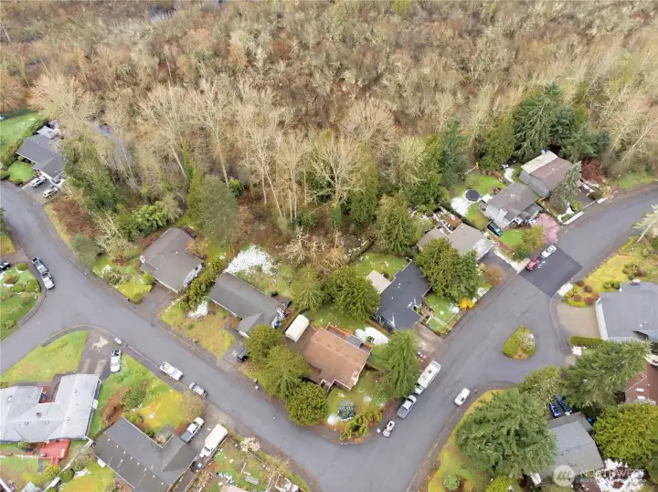 Bird's-eye perspective of the home's footprint and quiet neighborhood setting.