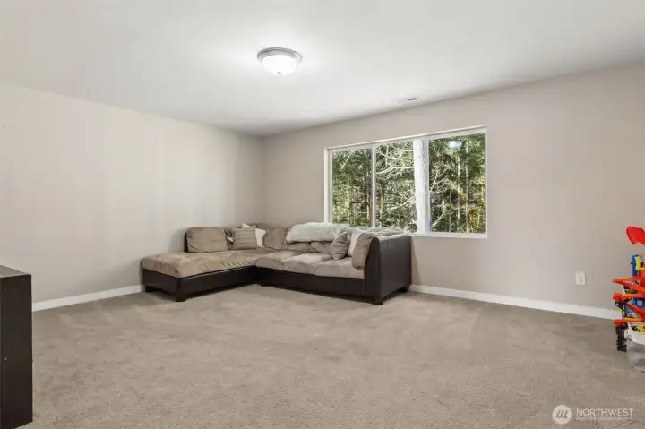 Large bonus room on the backside of the home overlooking greenbelt