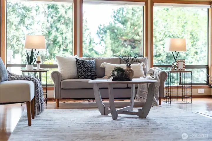 Cozy up to unwind in this relaxing space, overlooking views of the Puget Sound and Northwest firs.