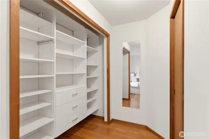 Shown here is the guest bedroom closet, and the door to the bathroom on the right.