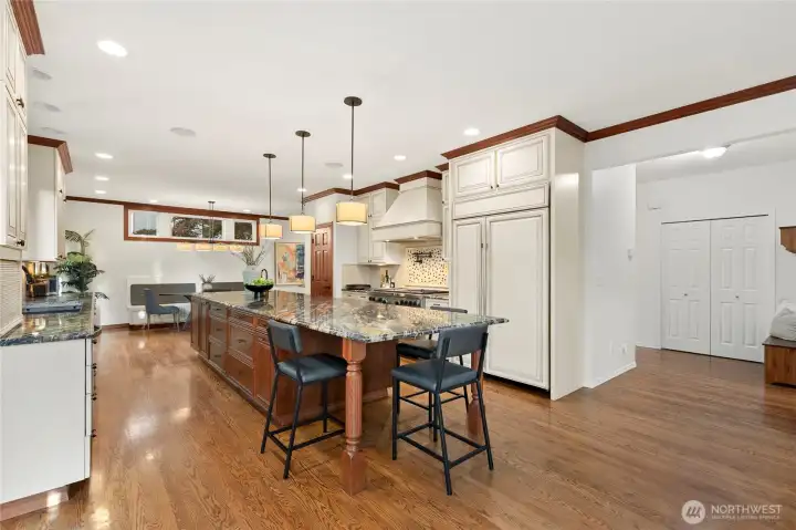 The jewel of this home is this remodeled and expanded kitchen featuring an amazing oversized island and high end appliances (Sub Zero fridge, warming drawer, etc)