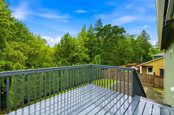 Step outside to a spacious deck overlooking a peaceful greenbelt, complete with a retractable awning that can be extended for shade or tucked away to enjoy the sunshine and scenic views. Step outside to a spacious deck overlooking a peaceful greenbelt, complete with a retractable awning that can be extended for shade or tucked away to enjoy the sunshine and scenic views.