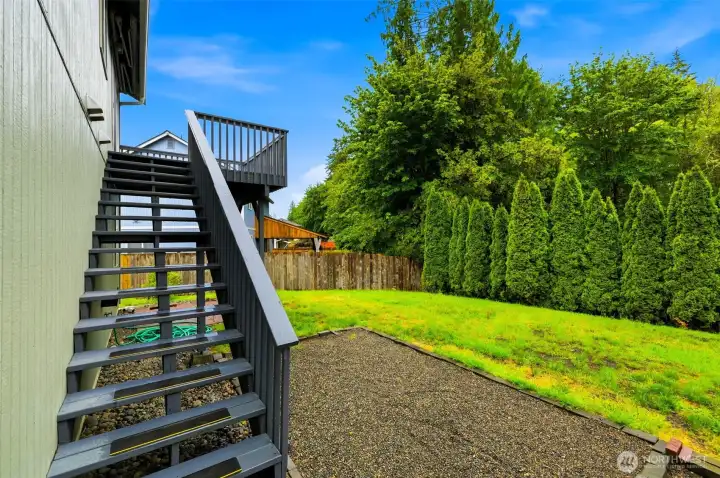 Enjoy your own backyard retreat with a generous grassy area, privacy-enhancing evergreens, and convenient deck access—perfect for summer BBQs, pets, play, and outdoor gatherings. Enjoy your own backyard retreat with a generous grassy area, privacy-enhancing evergreens, and convenient deck access—perfect for summer BBQs, pets, play, and outdoor gatherings.