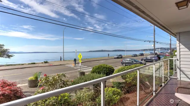 Million dollar view without the million dollar price tag!! Alki living at its best! Steps away from amenities of Alki Shores including heated pool & private gym and just a short stroll to the heart of the Alki community which features multiple restaurants, coffee shops and ample beach access to roam and enjoy. This unit offers sweeping, unobstructed views of the Puget Sound, Mountains and breathtaking sunsets. Efficiency was thought of in this beautiful modern update with ample storage in kitchen, hallway and closets. Kitchen also boasts Corian counters and all stainless appliances. Short distance to walk on ferry to Seattle allows you access to everything city yet also the comfort of your own private oasis. Come see for yourself!