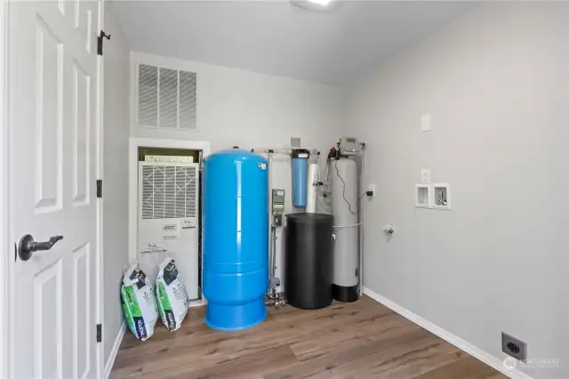 Laundry/Mechanical Room. All NEW Well Equipment just installed by Valley Pump. Electric Furnace. Washer & Dryer Hookups. Behind camera is door to back deck.
