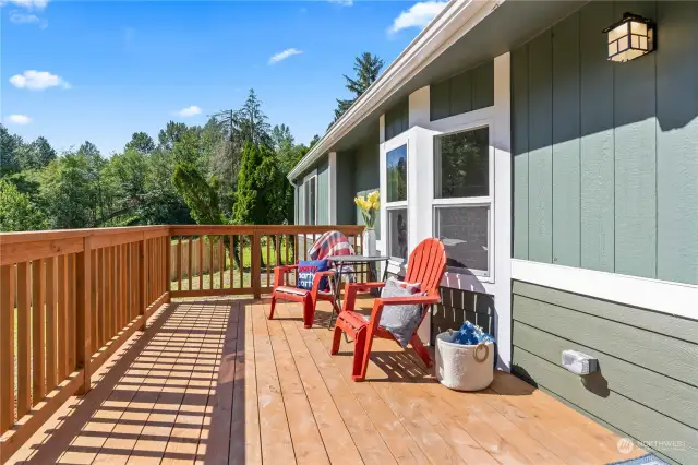 Brand New Large Deck overlooks the gently sloped front yard that leads to Lower Burnett Rd and South Prairie Creek on the other side of the road. Listen for a moment... you can hear the calming rush of the creek...