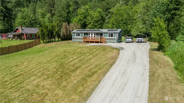Long Driveway on a gentle slope leads up to this beautiful home. The front yard contains the septic system (tanks and drainfield. RSS complete). Plenty of room behind the home for a shop!