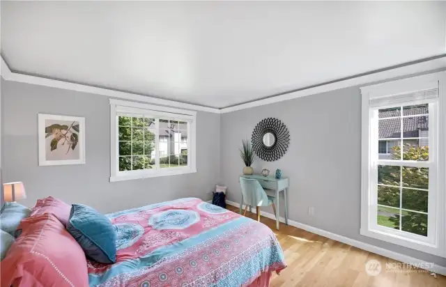 Bedroom. Photo includes staging, unit currently vacant.