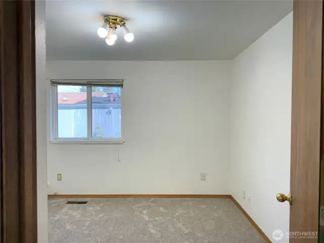 Second main floor bedroom in back off living room