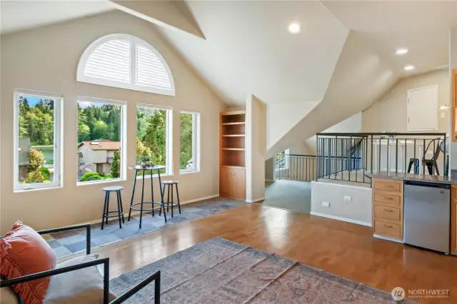 Let's go up to your loft where you will be impressed with all of the storage cabinets and light. This would make an amazing artist's space or office. You decide!