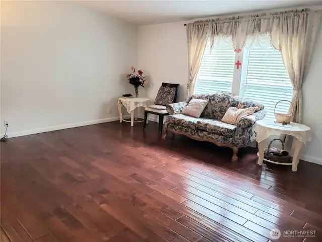 Another Different View of the Huge Living Room Showing Hard Wood Flooring, Newer Paint and Trim.