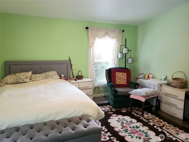 Another View of the Spacious Primary Master Bedroom Showing Hard Wood Flooring Showing Room for King Sized Bed and Room for Dressers.