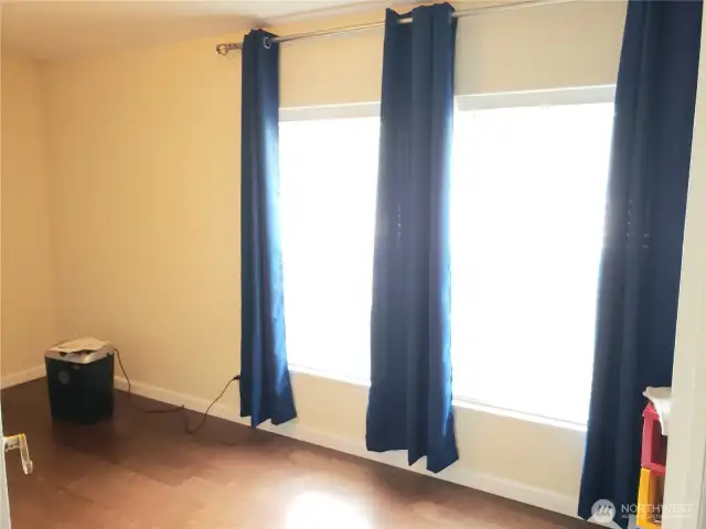 Huge Den/Office/Media Room or another Living Room Area with Hard Wood Flooring. Newer Paint and Trim.
