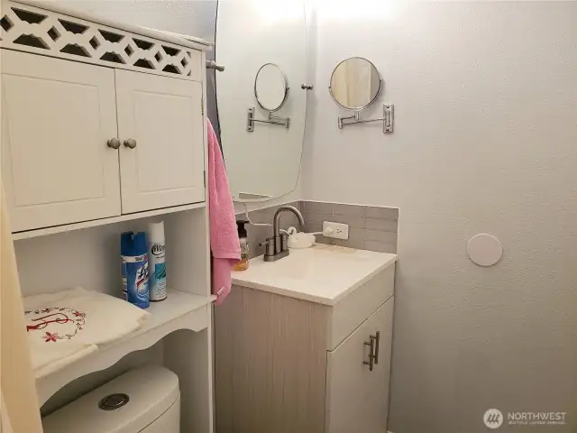 Another View of the very Nice Main Guest Bath Room with Tile Floor, Newer Paint, New Vanity, Faucet and Toilet.
