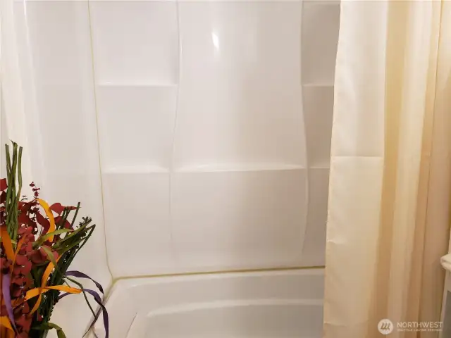 A very Nice Main Guest Bath Room Showing The Full Tub and Shower.
