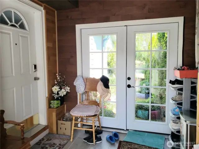 Nice Covered Enclosed Front Entry Room that leads into the Home through the Front Door and also leads to the Back Yard.