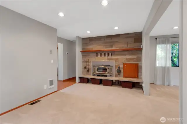 Wood burning fireplace with wood storage.