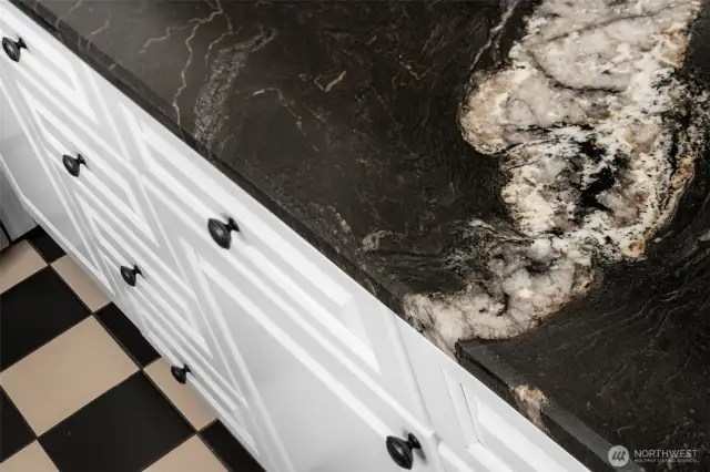 Titanium Gold Granite Counters. One beautiful feature of this is inclusion of tiny red garnets that sparkle in the sunlight!