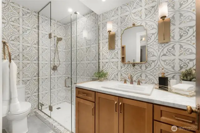 Ensuite Bathroom Remodel in 2024. Carrara Marble Counters, Custom Maple Vanity from Seattle Cabinets.  Concrete Tiles with Brass Insets (!), Brass Fixtures, and Heated Floors on a Timer.