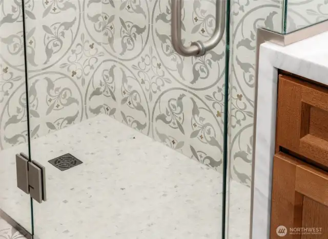 See the Brass Flowers in the Tile?