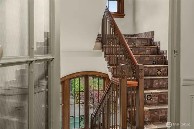The Encaustic Tile Stairway with Mahogany and Iron Railings, along with Stained Leaded Glass Windows are all Original and a Delight to Experience.
