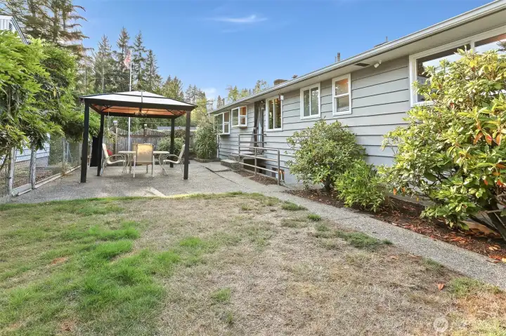 Private backyard facing west toward gazebo