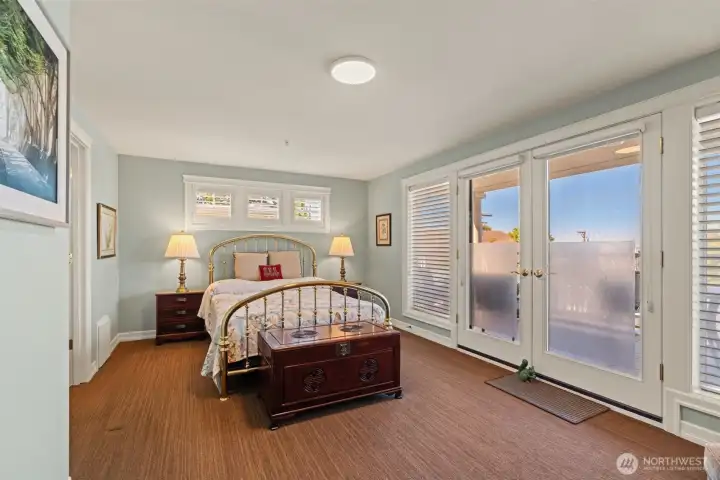 Primary bedroom with access to the deck.