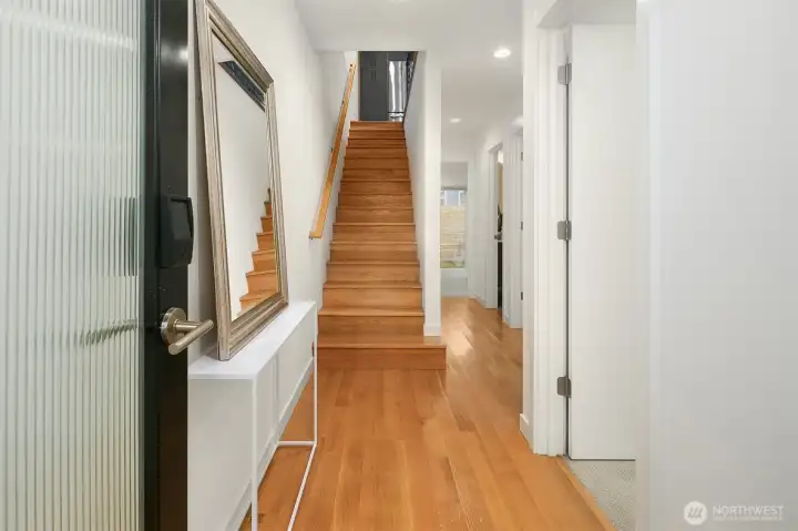Entry with solid hardwood floors.